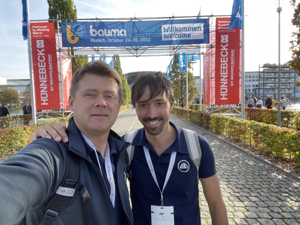 Selfie photo of 3Dsurvey CEO and Product Manager outside at the entrance to Bauma Expo 2022