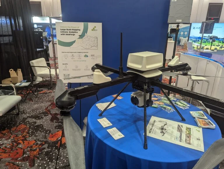 A photo of a large black and white Netra V4 Pro drone on display at an expo