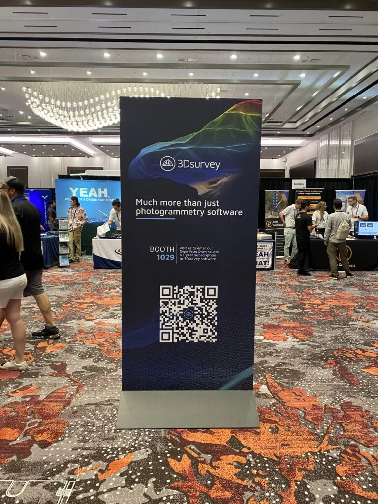 A vertical advertising board promoting 3Dsurvey software at Commercial UAV Expo