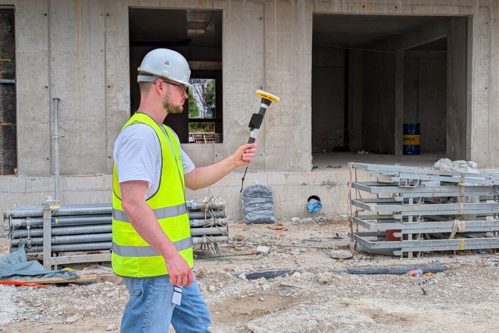 Trimble Catalyst DA2 GNSS device in use on construction site