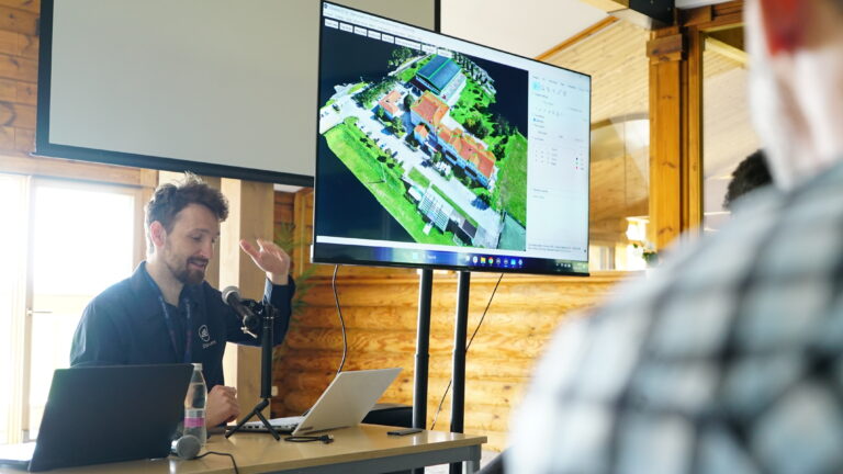 A man presenting at a conference