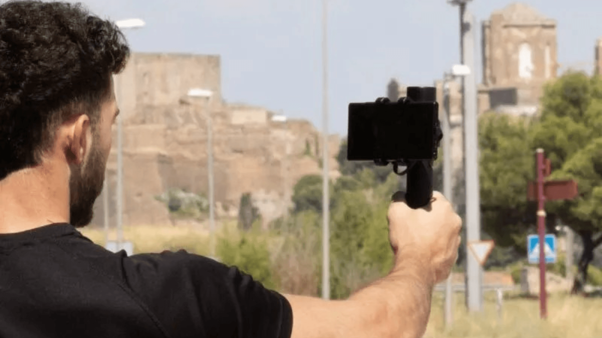 Person holding Smartphone with ArduSimple GNSS antenna