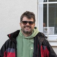 man with sunglasses smiling